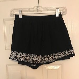 black with white embroidering shorts